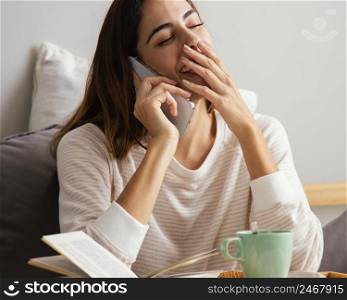 woman talking phone home laughing