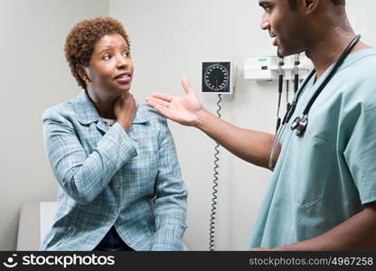 Woman talking to doctor