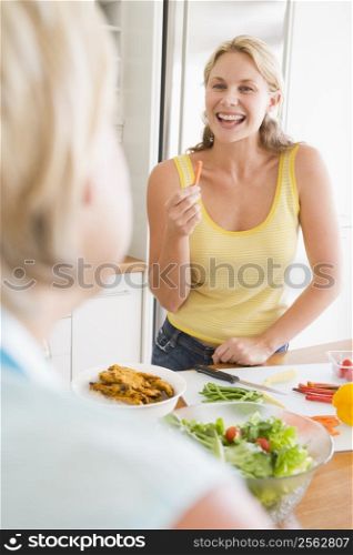 Woman Talking To Friend While Preparing meal,mealtime