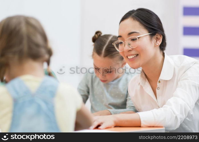 woman talking with her students during class