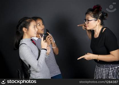 woman teacher and two girl student excited,violence theme. woman teacher and two girl student excited,violence theme