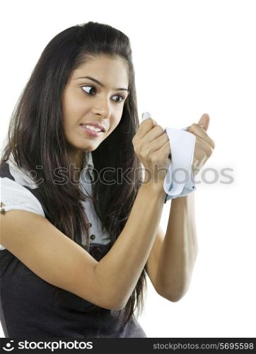Woman tearing a piece of paper