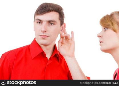 Woman telling man some secrets, couple talking gossiping. Excited emotional girl whispering to boyfriend ear