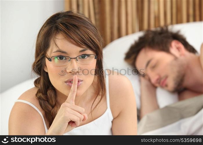 Woman telling you to be quiet while her lover sleeps