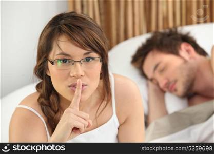 Woman telling you to be quiet while her lover sleeps