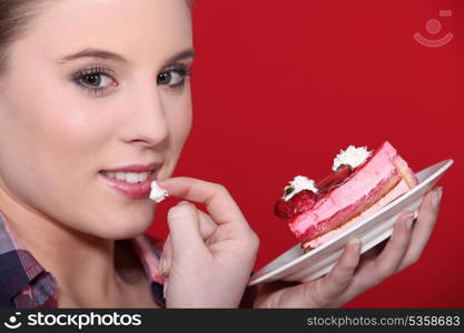 Woman tempted by a piece of cake