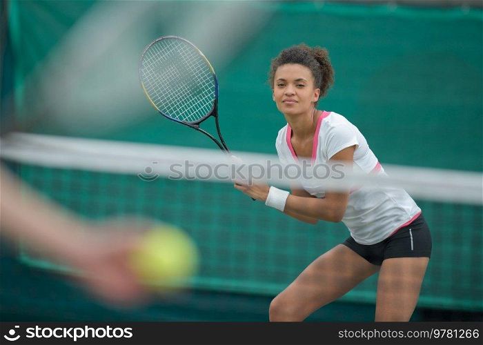 woman tennis player with racket during a match game isolated