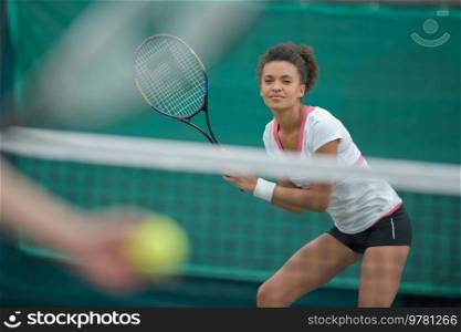 woman tennis player with racket during a match game isolated