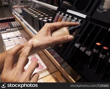 Woman testing cosmetics in shopping mall, Beauty and lifestyle concept
