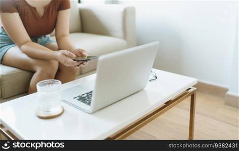 Woman texting checking social media holding smartphone at home Conversation with boyfriend or friend.