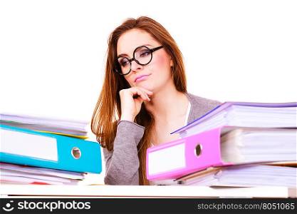 woman tired with stack of folders documents. Woman working in office. Young overworked businesswoman or distressed secretary with a lot of documents folders bills on her desk. Business and paperwork. Studio shot on white.
