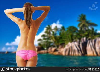 Woman topless on beach at Seychelles. Collage.