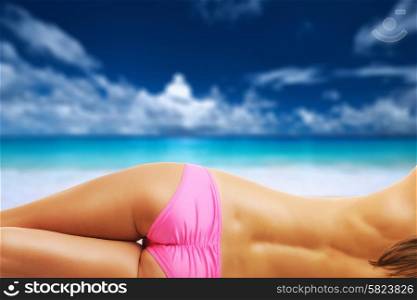 Woman topless on beautiful beach Anse Intendance at Seychelles. Collage.