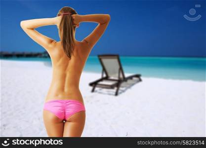 Woman topless on beautiful beach at Maldives, South Male Atoll. Collage.