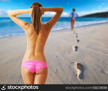 Woman topless on beautiful beach at Seychelles. Collage.