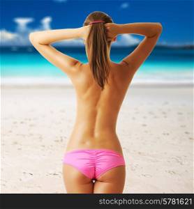 Woman topless on beautiful beach at Seychelles, Praslin, Anse Lazio. Collage.