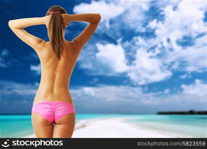 Woman topless on beautiful island beach with sandspit at Maldives. Collage.