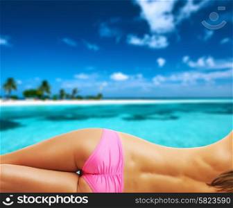 Woman topless on beautiful island beach with sandspit at Maldives. Collage.