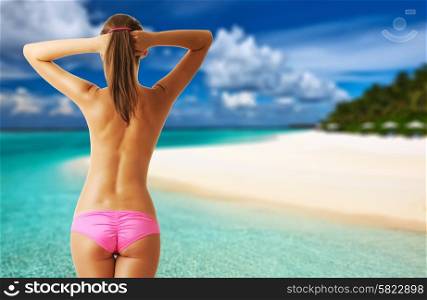 Woman topless on tropical beach with crystal clear turquoise water at Maldives. Collage.