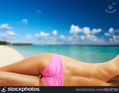 Woman topless on tropical beach with crystal clear turquoise water at Maldives. Collage.