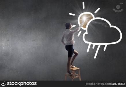 Woman touch cloud. Businesswoman standing on chair and reaching cloud in sky