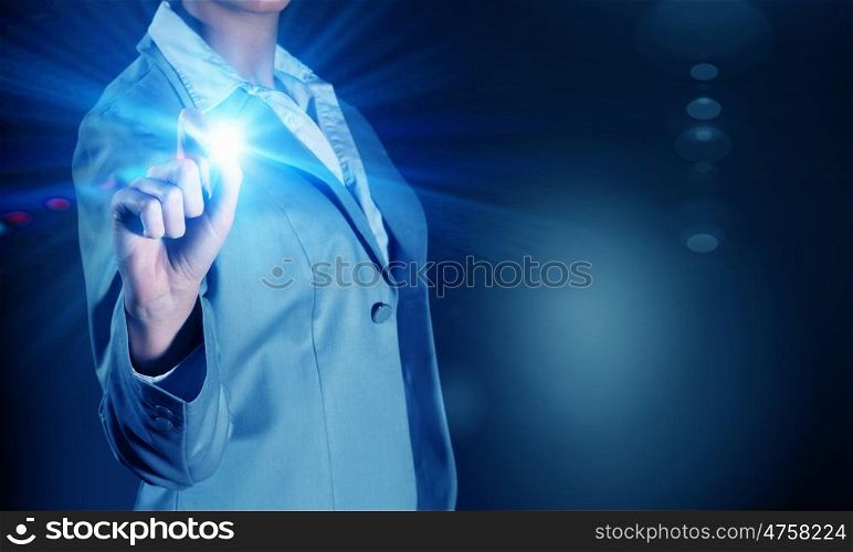 Woman touch light spot. Businesswoman touching light button on blue screen