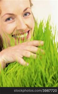 Woman touching grass