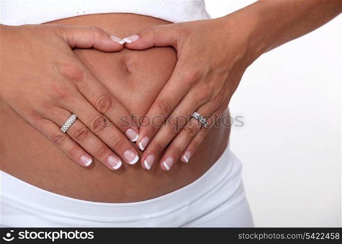 Woman touching her pregnant belly