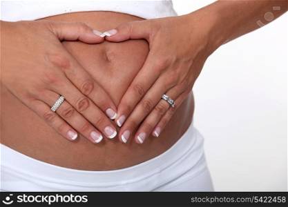Woman touching her pregnant belly