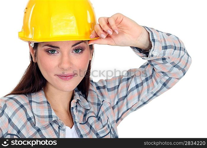 Woman touching the brim of her hard hat