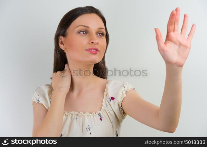 Woman touching virtual button
