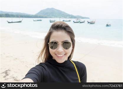 woman tourist is selfie in Phuket sea in Thailand