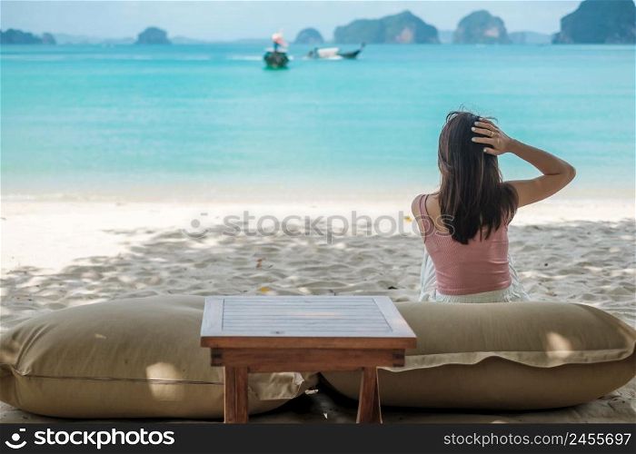 Woman tourist rest on Beautiful beach Island at summer. destination, wanderlust, Asia Travel, tropical summer, vacation and holiday concept