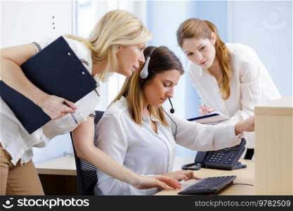 woman training to use switchboard