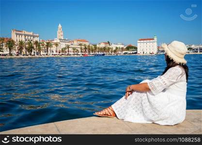 Woman traveler travel to old town of Split in Dalmatia, Croatia. Split is the famous city and top tourism destination of Croatia and Europe.