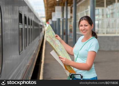 woman traveling alone keeps the card at the station