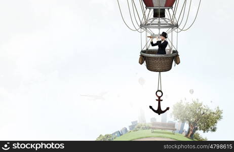 Woman traveling in aerostat. Young businesswoman flying hight in sky in colorful aerostat