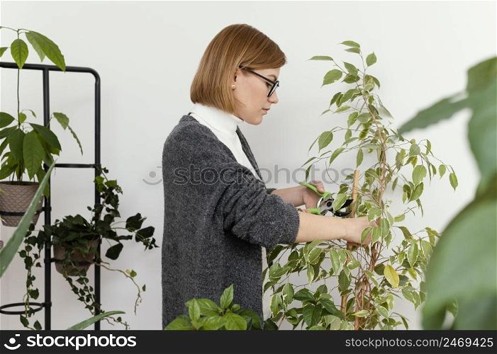woman trimming plant