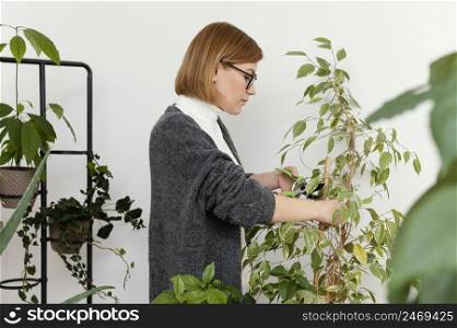 woman trimming plant