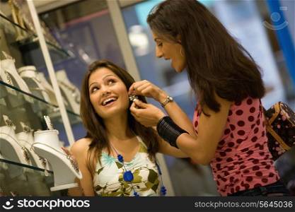Woman trying a ear ring
