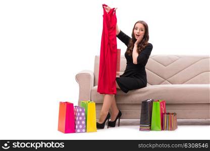 Woman trying new clothing sitting on sofa