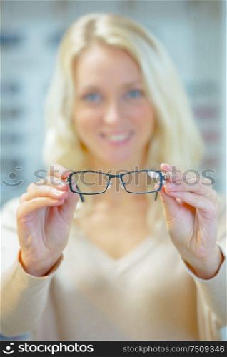 Woman trying on a pair of glasses