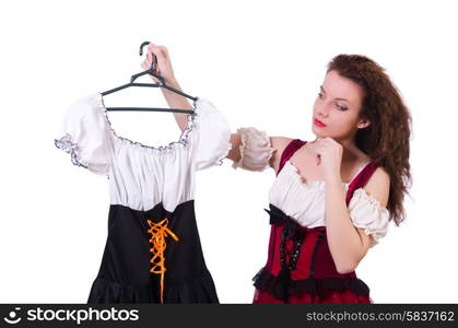 Woman trying to choose dress on white