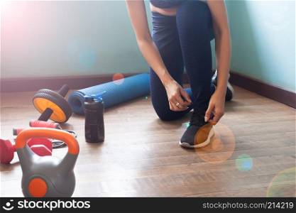 Woman tying shoes for exercise, Healthy lifestyle