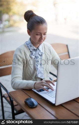 woman typing during work outdoor