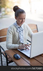 woman typing during work outdoor