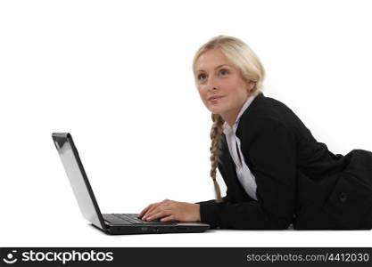 Woman typing on her laptop