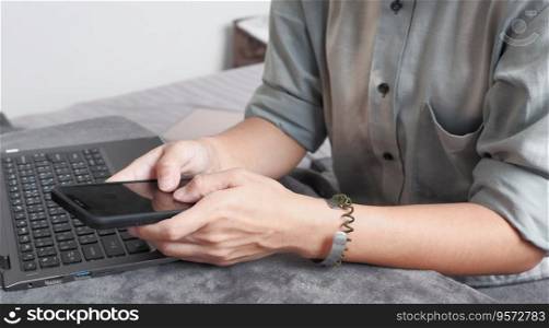 Woman typing on mobile phone Suitable for making infographics.