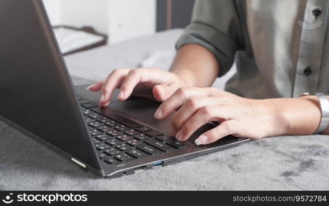 Woman typing work or chatting on laptop Suitable for making infographics.