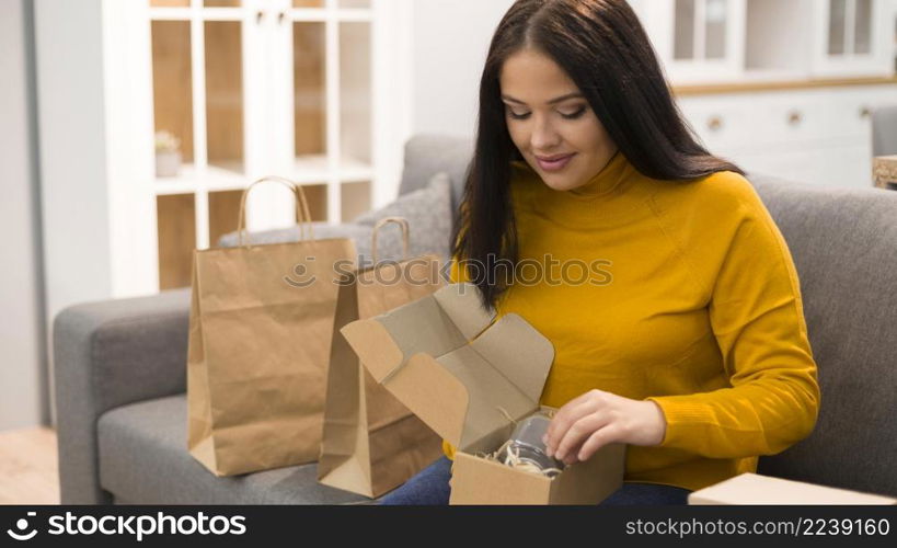 woman unboxing her new purchase